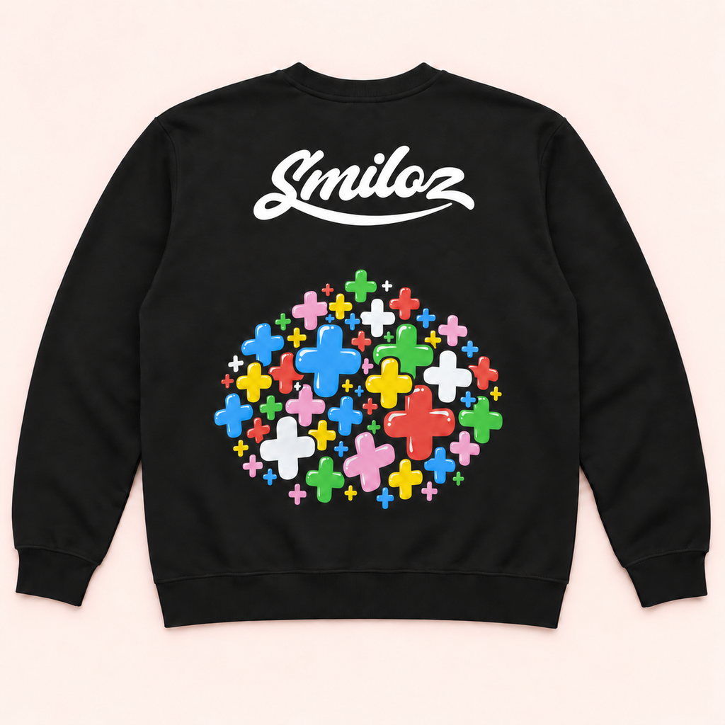 Back of black Smiloz crewneck jumper with white upper-back script and a separate multicolour plus-sign print